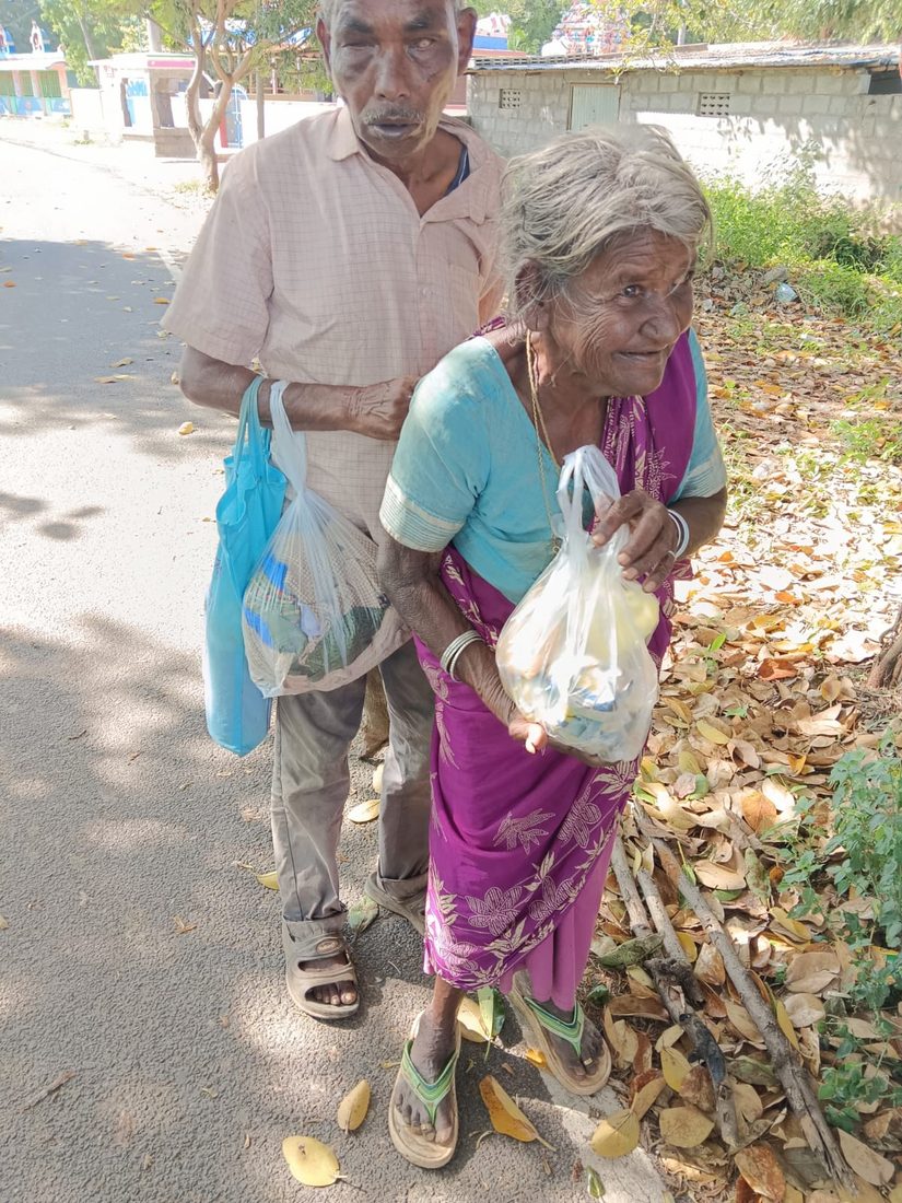 Sandals and provisions for an elderly couple met on the roadside.